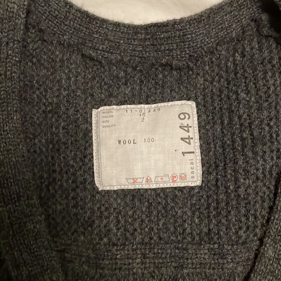 Sacai wool v-neck peplum sweater with ribbon detail and front pockets. - Picture 2 of 3